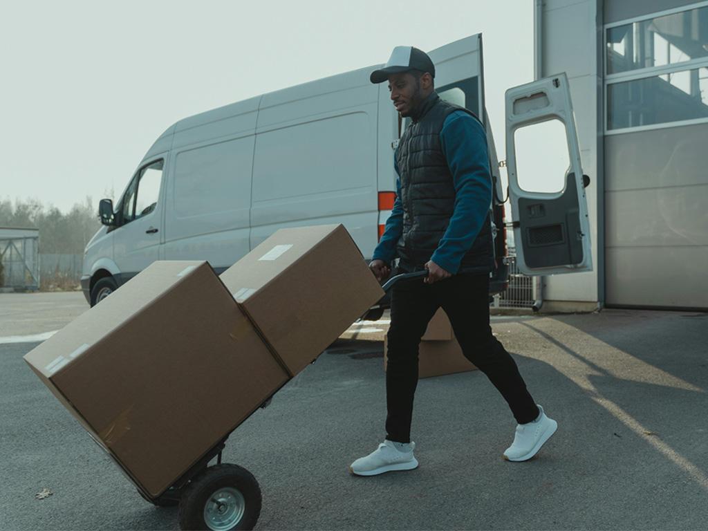 Professional moving boxes with a hand truck and delivery van