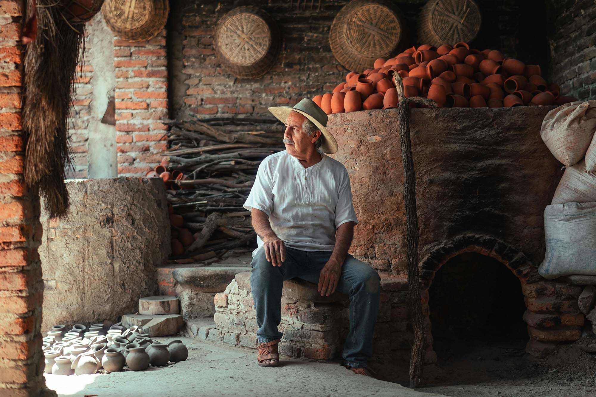 Background image showing man in front of his traditional business